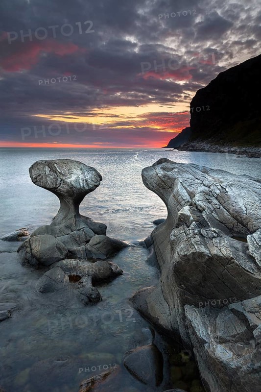 Kannestein or Kanne Stone with coastline at sunset
