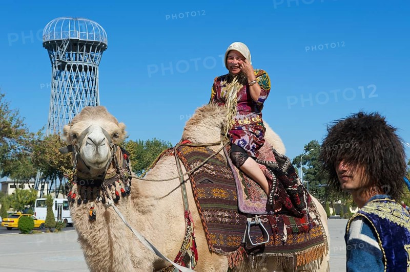 Local tourist on a camel outside the Ark fortress
