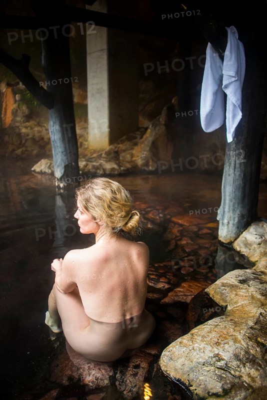 Woman enyoing the hot waters of the Kurokawa onsen