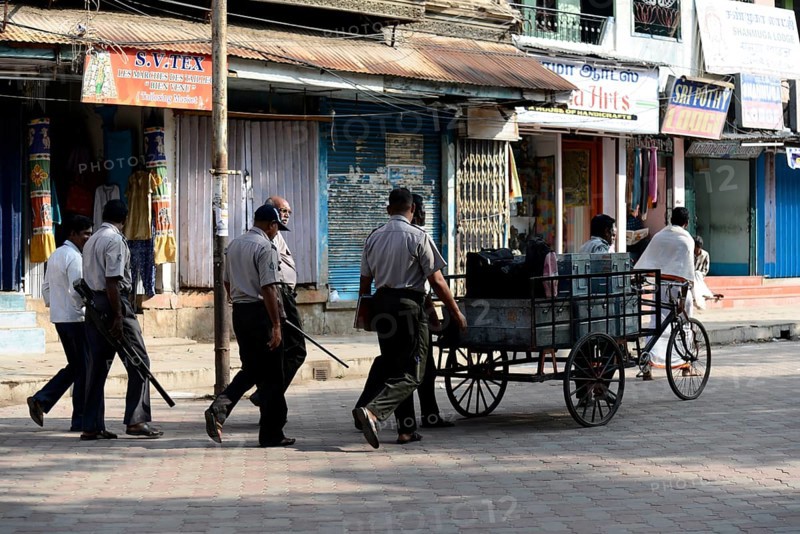 Money transport with armed escorts
