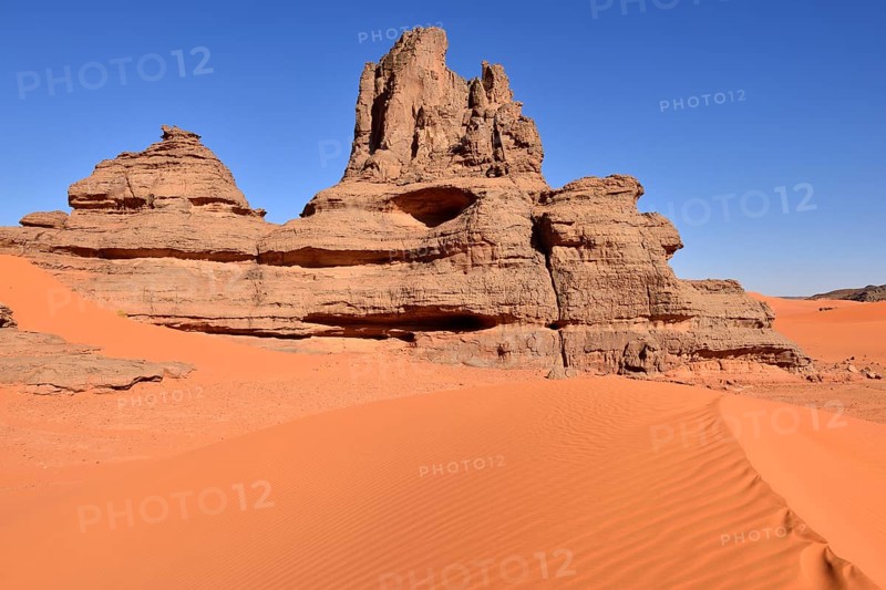 Rock towers in the sand dunes of Tin Merzouga