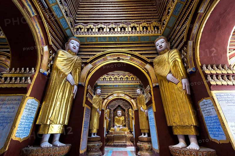 Seated and standing Buddha statues