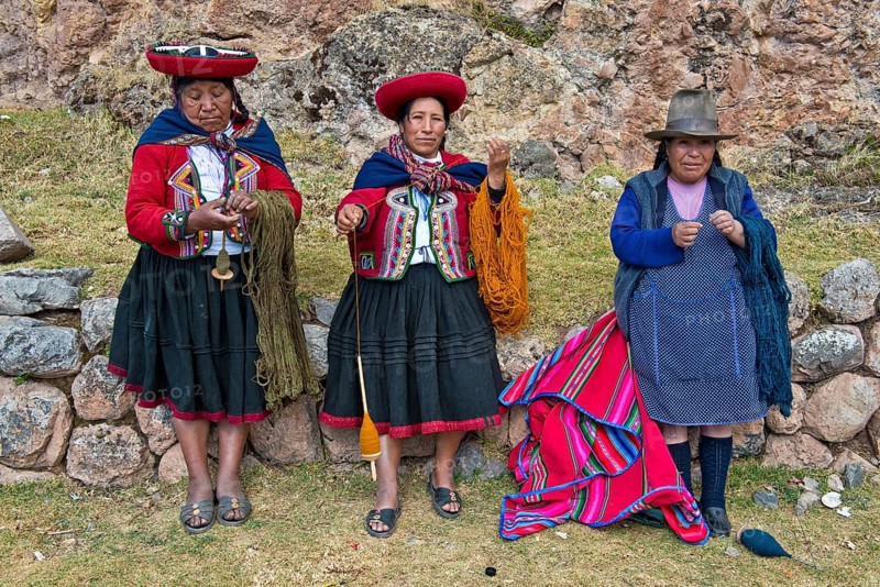 Three elderly women wearing hats