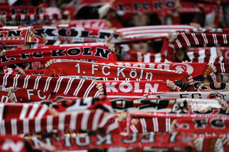 Cologne fans holding their scarves up