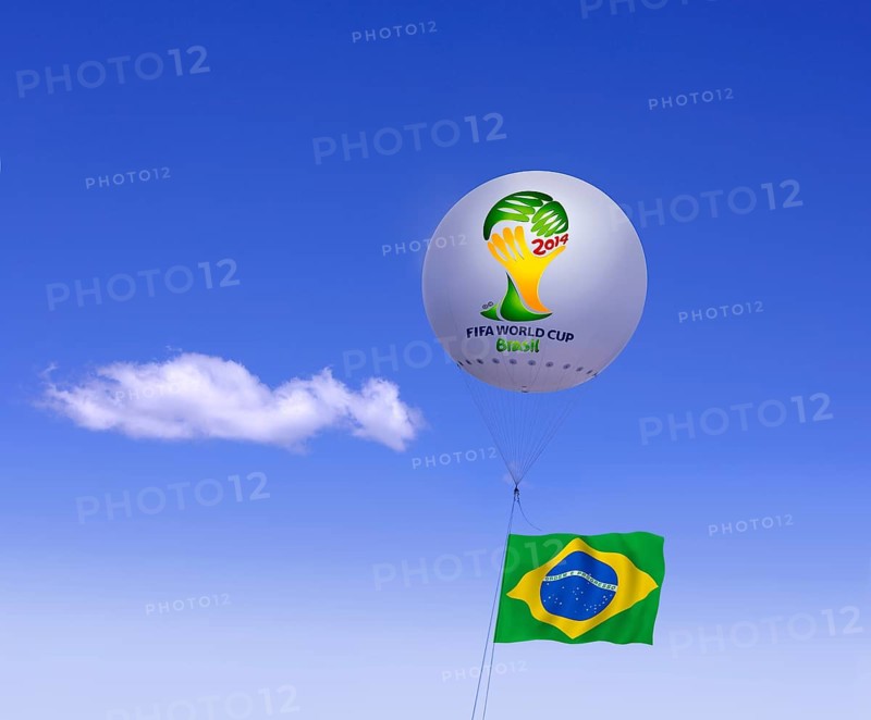 Logo of FIFA World Cup Brazil on moored balloon and Brazilian flag