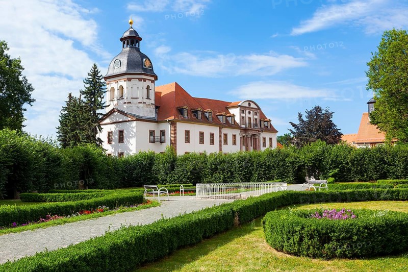 Schlosspark palace gardens with Schloss Christiansburg Palace and the Baroque Cross Church of St. Trinitatis