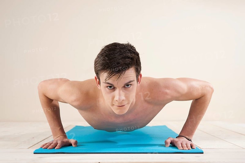 Young man doing pushups