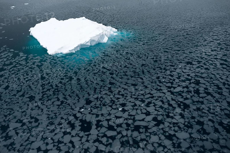 Iceberg surrounded by slush