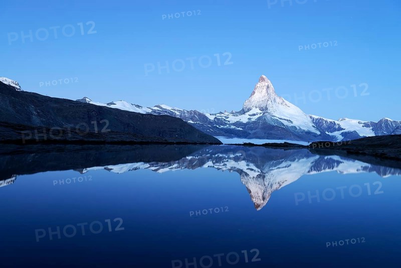 Mt Matterhorn reflected in Stellisee Lake at dusk