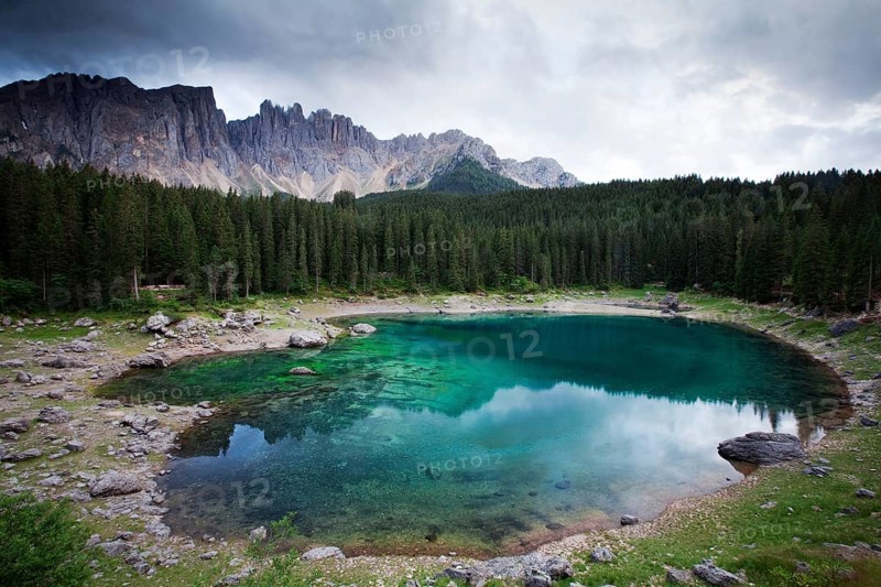Lake Carezza with Latemar Mountain with clouds