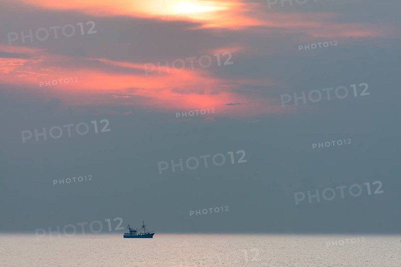 Shrimp boat at sunset