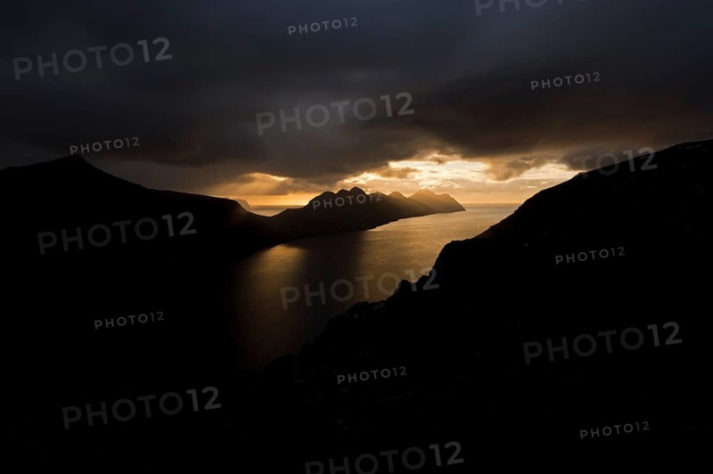 Dramatic mood lighting over the islands of Kalsoy and Kunoy