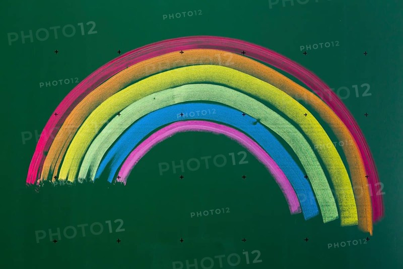 Rainbow drawn with chalk on a blackboard