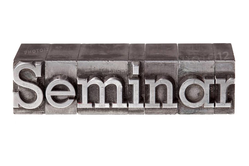 Old lead letters forming the word 'Seminar'