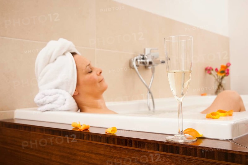 Woman relaxing in a bath