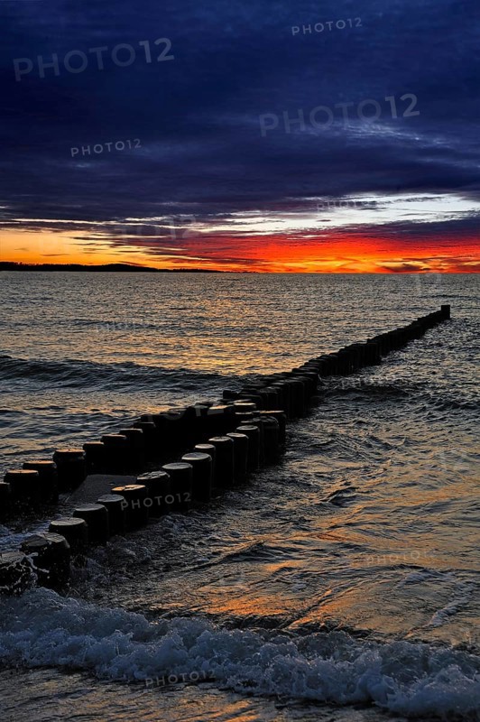 Groynes on a Baltic Sea beach before sunset