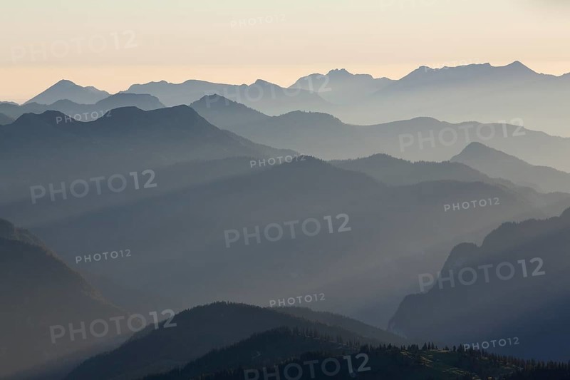 Backlit mountain ridges seen from Hochiss Mountain in Rofan