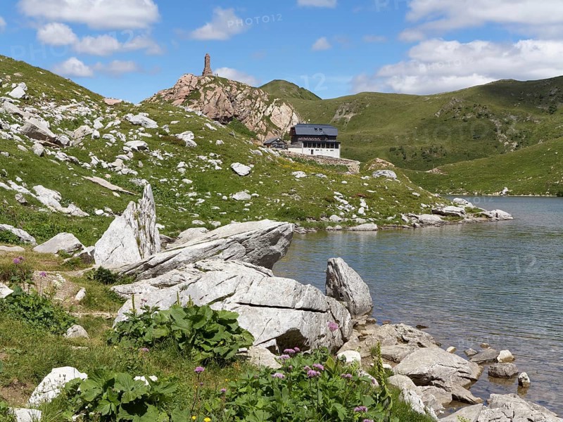 Wolayer Lake or Wolayersee with the Wolayersee hut and war memorial
