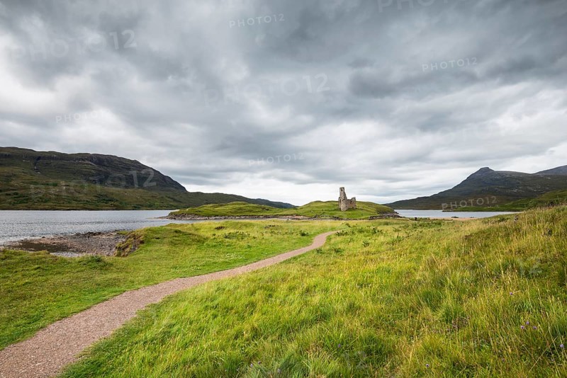 Footpath to the ruins of Ardvreck Castle on a peninsula in the lake of Loch Assynt