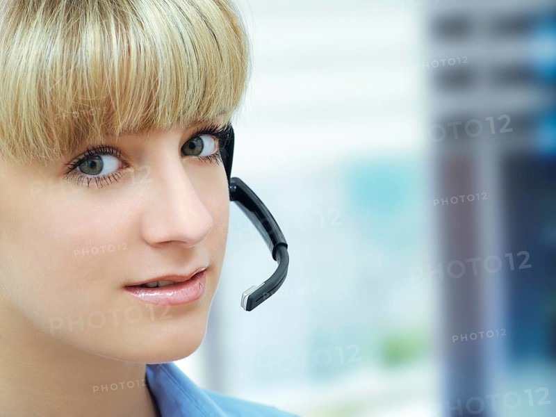 Businesswoman wearing a headset in an office