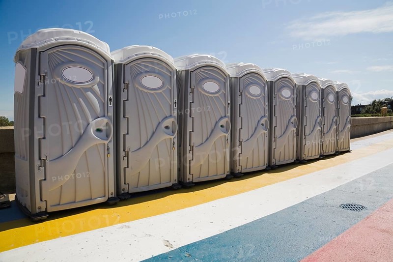Row of portable toilets outdoors