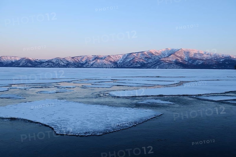 Early morning mood on the frozen Lake Kussharo with ice floes in the front