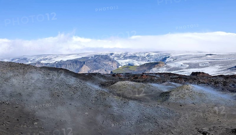 View across new lava fields created by a volcanic eruption in 2010 to the Myrdalsjokull glacier