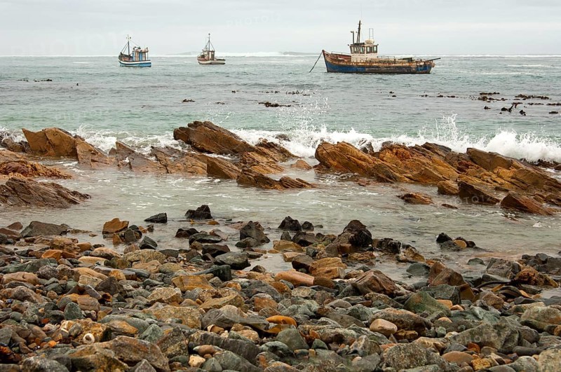 Fishing boats in bad weather at sea off the coast of Port Nolloth