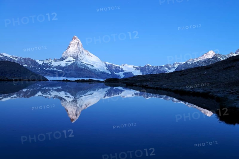Mt Matterhorn reflected in Stellisee Lake at dusk