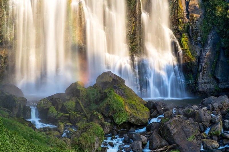 Marokopa Falls in the evening light with a rainbow