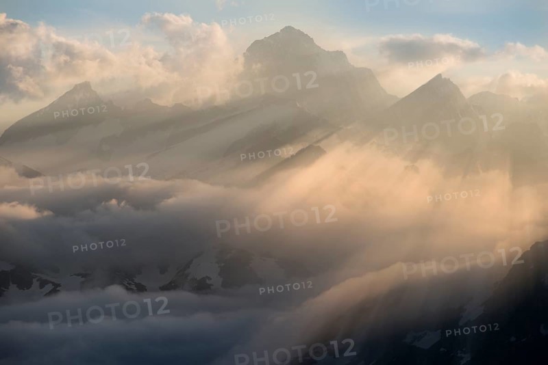 Clouds at the Furka Pass with mountains Finstaarhorn