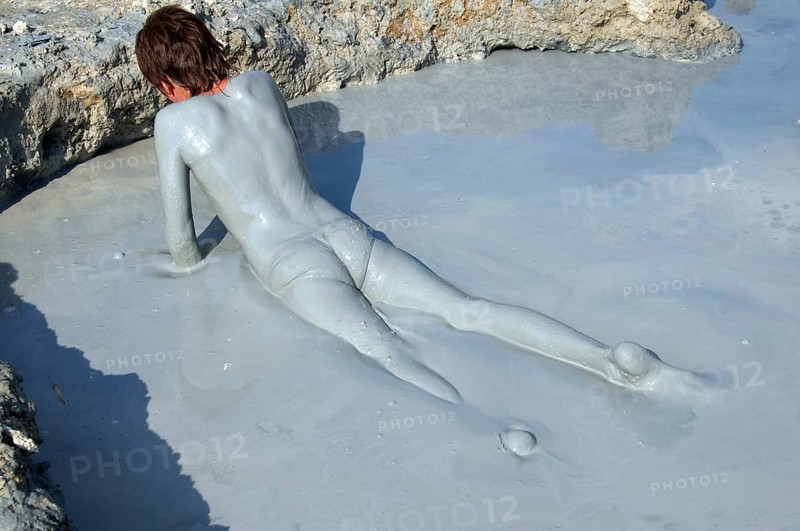 Man with a mud-covered body