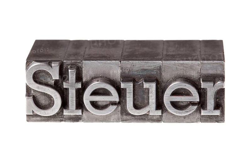 Old lead letters forming the word 'Steuer'