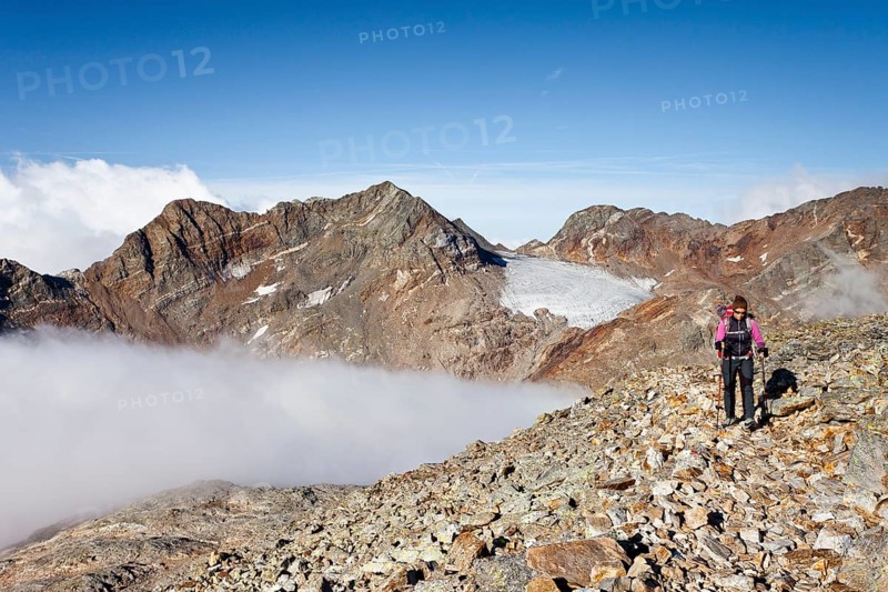 Mountain climber during the ascent of Fernerkoepfl Mountain in the Rieserferner Group in the Puster Valley