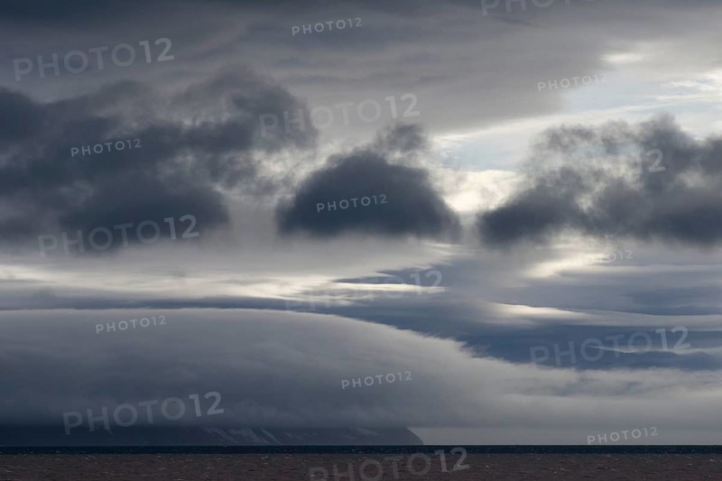 Storm clouds obscuring the mountain scenery in Palanderbukta fjord