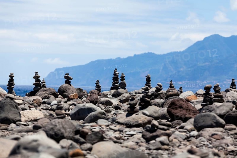 Cairns built as good luck charms at the Ilheus da Rib rock formation