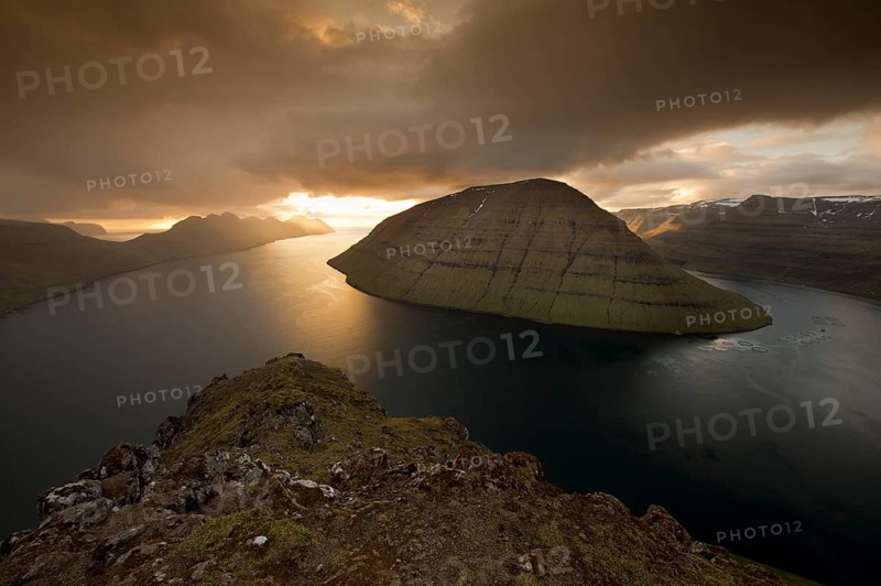 Dramatic mood lighting over the islands of Kalsoy