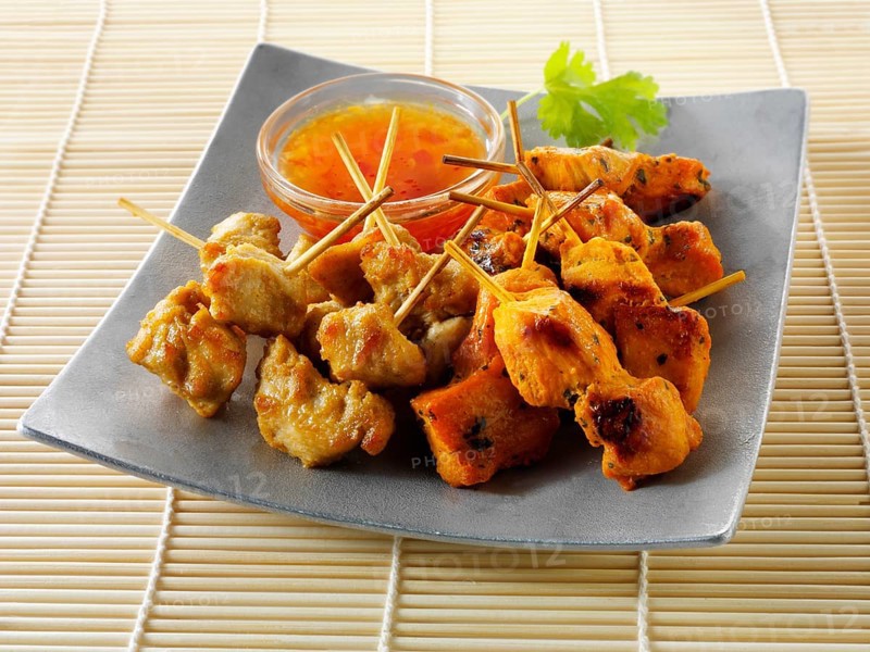 Traditional oriental satay skewers with chilli dip