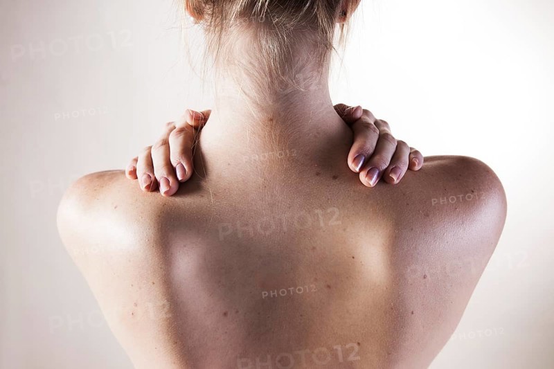 Bare shoulders of a young woman