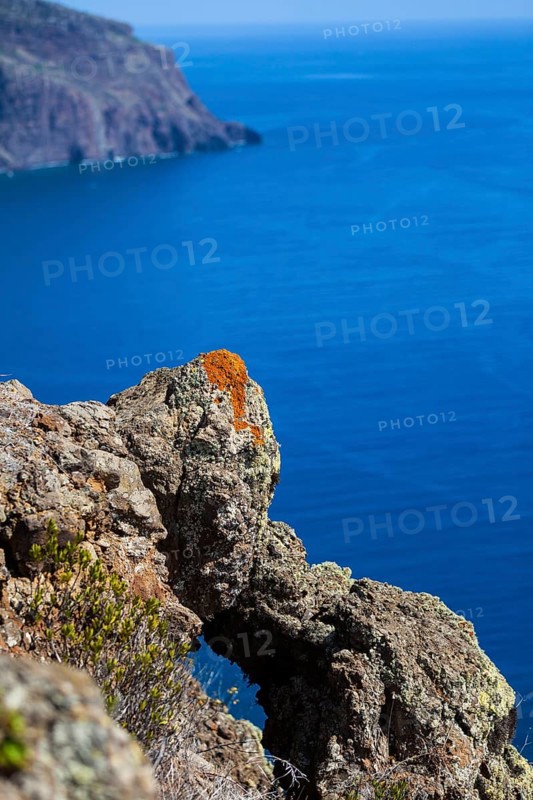 Cliff coast near Ponta do Pargo with lichen growing on the rocks