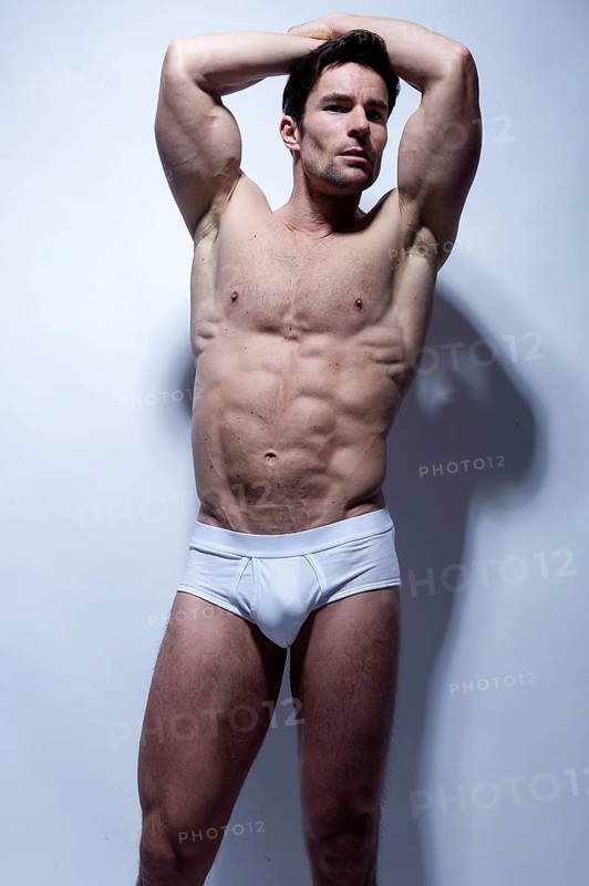 Muscular man in white underwear