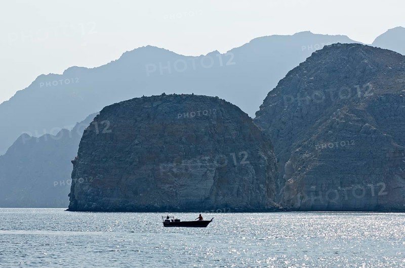 Khor Ash Sham Fjord with a fishing boat