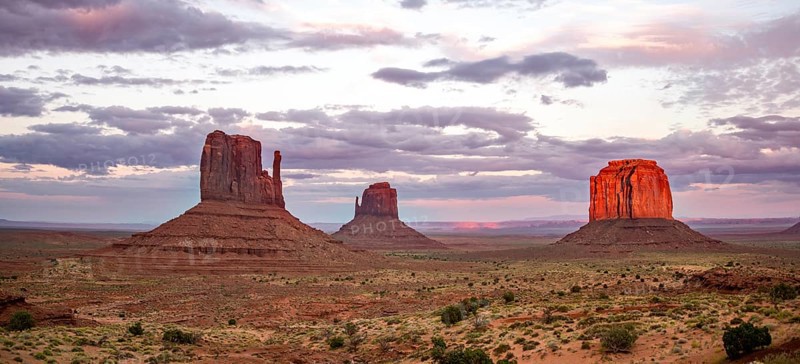 Red glowing rock formation at sunset