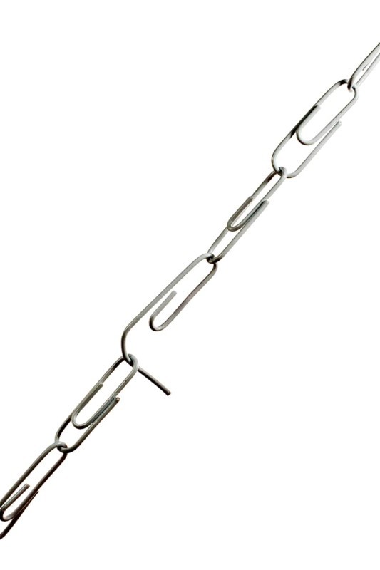 Chain of paper clips threatening to break at its weakest link