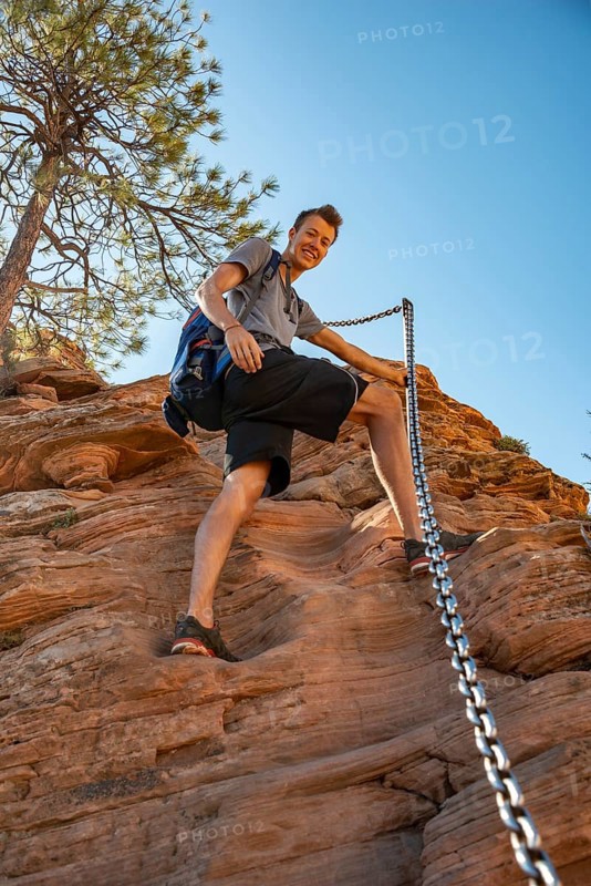 Young man hikes on Angels Landing Trail