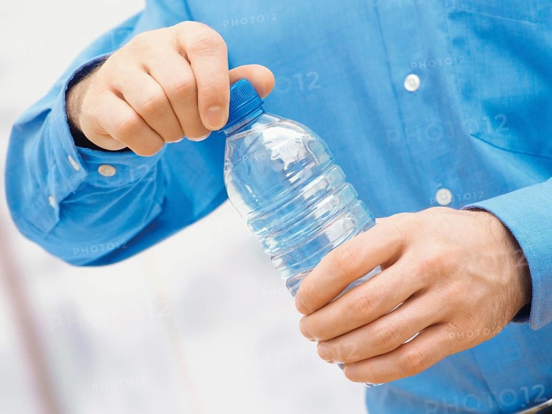 Man opening a water bottle