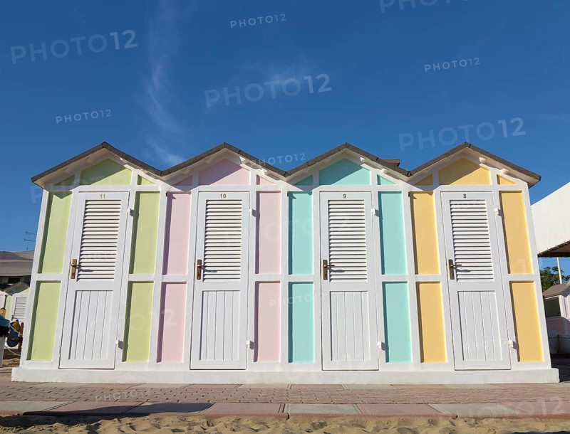Pastel coloured beach cabins