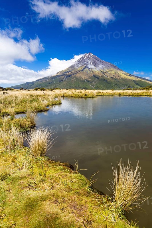 Mountain lake with the Mount Taranaki volcano