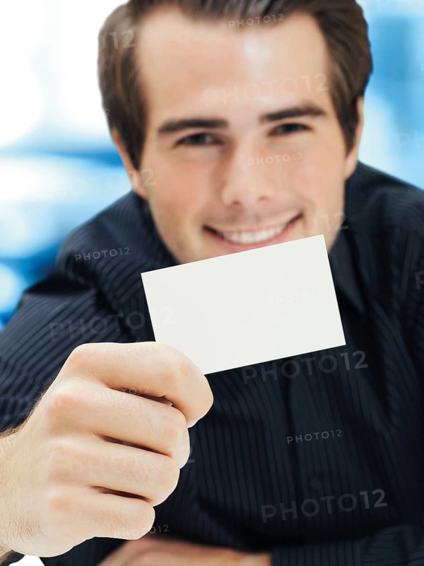 Businessman showing blank business card