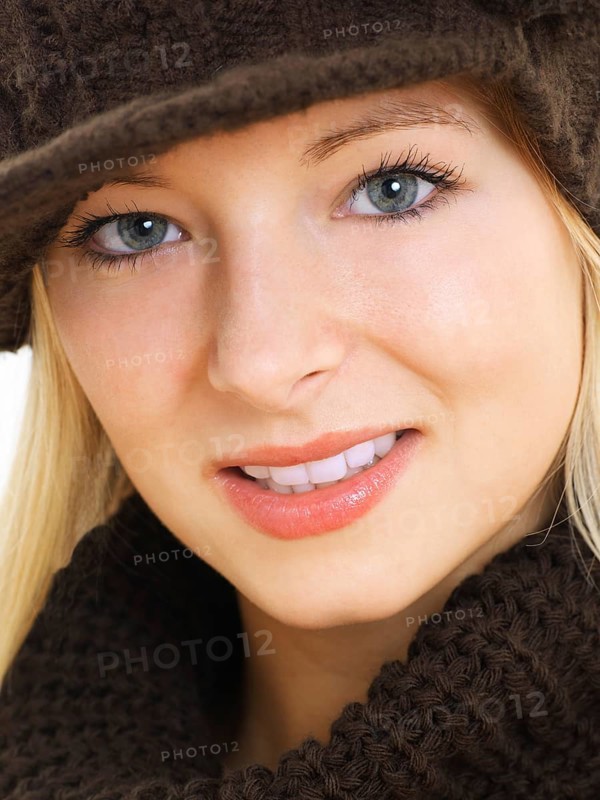Young woman wearing a brown hat